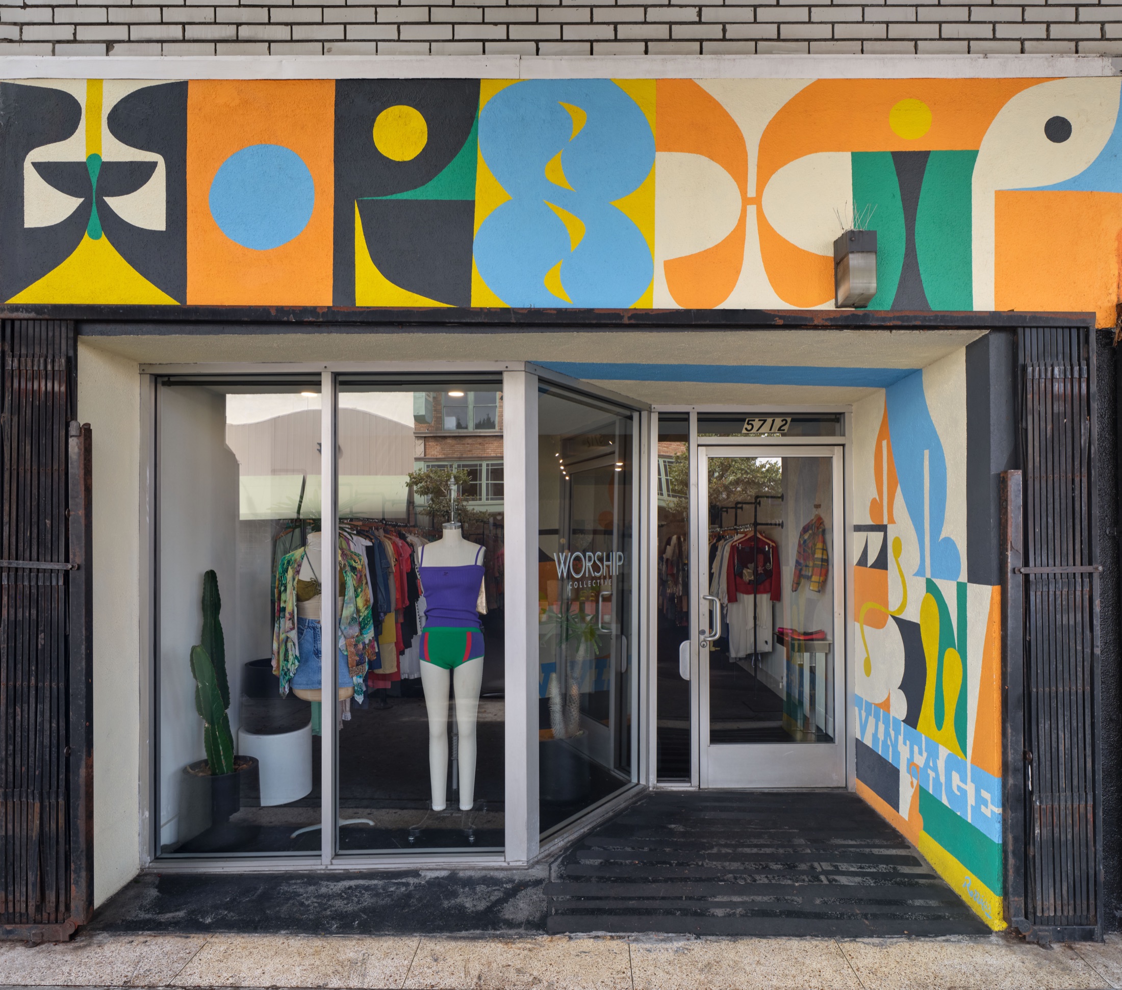 Worship Collective Highland Park storefront with a colorful mural facade