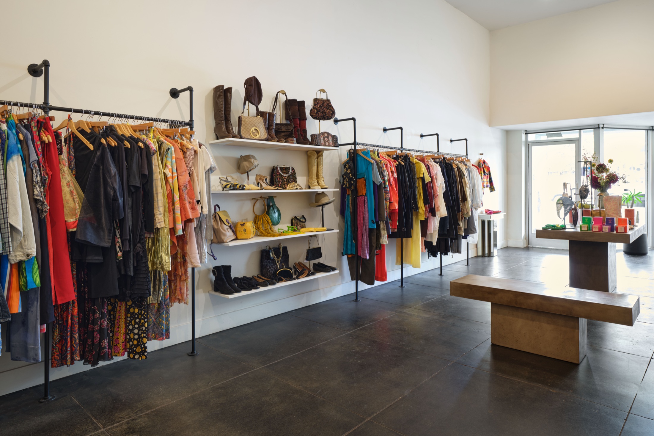 Curated racks of vintage clothing and accessories inside Worship Collective